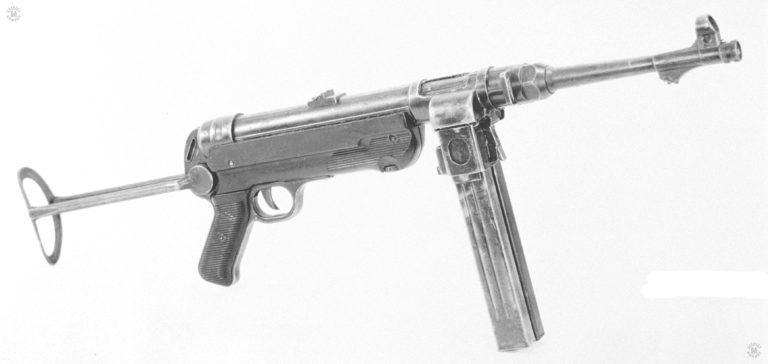 In an effort to match the firepower of the Soviet drum-fed PPsH-41 submachinegun on the Eastern Front, German weapon designers came up with this modification of the standard MP40. Replacing the magazine housing with a modified version, the MP40/1 was developed. The two magazines give the weapon a total ammunition capacity of 64 rounds. Once on magazine was emptied, pressing in the lever at the front of the housing allows the user to quickly slip the loaded magazine into place. Note that this specimen is missing the barrel rest. PHOTO CREDIT: US Army