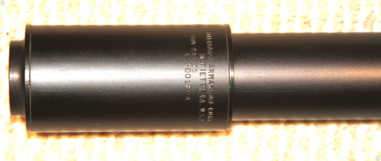 A close-up of the markings on an M10 .45 MAC suppressor. A portion of the serial number was removed in the processing of this photo. PHOTO CREDIT: Kevin Dockery