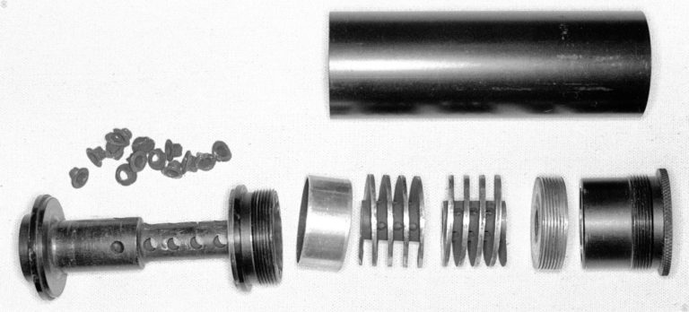 The internal components of the M10 .45 MAC suppressor, minus the rear expansion tube. The parts are as follows:
#1 – Front tube
#2 – Filler eyelets for expansion chamber
#3 – Sleeve (Mounting)
#4 – Bushing
#5 – Baffle
#6 - Right Hand Spiral
#7 – Left Hand Spiral
#8 – Encapsulator with Wipe
#9 – End Cap Assembly with two internal spaced wipes