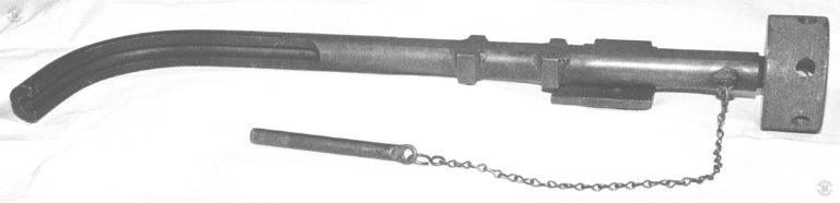 A side view of the 90-degree curved barrel attachment developed by the US Army following World War II. The curved portion of the device can be seen to be a trough rather than a barrel. This allows the projectiles to more easily negotiate the sharp curve. In spite of this, bullet fired through the device would deform and sometimes fragment. Given that the expected range of the device when used to defend a buttoned-up tank would be ten to fifteen feet, fragmentation of the bullets was not considered a great drawback. PHOTO CREDIT: Kevin Dockery
