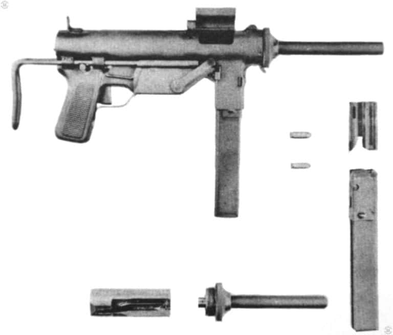 M3 with 9mm Conversion – 03
     This is the conversion kit used to change the M3 submachinegun over from a .45 ACP weapon to one using the 9x19mm round. The part numbers are;
1 – The magazine well adapter to allow the weapon to feed from a Sten gun magazine
2 – a .45 ACP round
3 – A 9x19mm round
4 – The standard 32 round Sten gun magazine, a double column, single feed design
5 – The 9mm barrel assembly
6 – The 9mm bolt assembly
PHOTO CREDIT: US Army