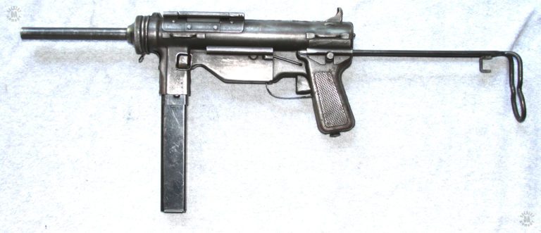 The left side of an M3A1 with the stock fully extended and a magazine locked in place. The lug on the side of the magazine is a stop that prevents the mag from being inserted too far into the magazine well. PHOTO CREDIT: Kevin Dockery