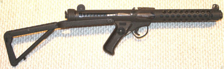 The right side of a Sterling L2A3 with the stock extended. The bolt is in the forward (uncocked) position and in this lighting the helical pieces on the bolt can be seen plainly, particularly through the cocking handle slot. There is no magazine in this weapon.  PHOTO CREDIT: KEVIN DOCKERY
