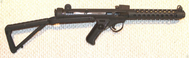 A view of the Sterling L2A3 with the bolt cocked. The safety switch on the other side of the pistol grip will lock the bolt in the forward or cocked position, preventing accidental fire. PHOTO CREDIT: KEVIN DOCKERY