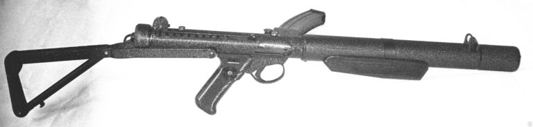 Right side view of the Sterling Mk 5 as produced for international commercial sale. The two studs along the top centerline of the receiver, in front of the rear sight and above the ejection port, are mounts for the optional Sterling sight rail which accepts a number of telescoping and electronic sighting systems. Fitted with a night vision device, this extremely quiet submachinegun is very effective at night. PHOTO CREDIT: KEVIN DOCKERY