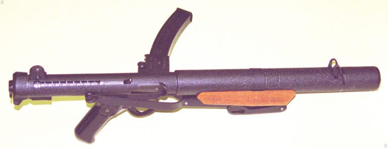 The Sterling Mk 5 suppressed submachinegun with the stock folded and secured to the underside of the front grip. PHOTO CREDIT: KEVIN DOCKERY