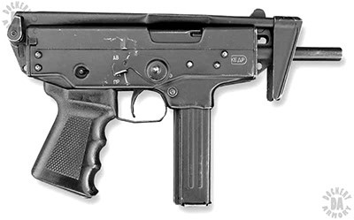 The PP-91 in its most compact form with the stock folded over the top of the receiver and the weapon loaded with a 20-round magazine. The bolt is in the forward position. The selector switch is pushed up past the ОА notch and needs to be set in a specific notch to prevent a failure to fire. PHOTO CREDIT: DUTCH HILLENBURG