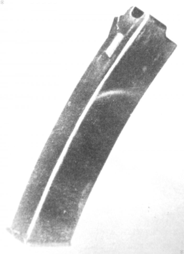 This is the 25-round box magazine used in the PPD-34. The magazine is rather small for the application and is formed from sheet metal. The smooth sides and lack of reinforcing ribs makes this design susceptible to damage. This magazine may also be used in the PPD-34/38 in place of that weapon’s more common drum. The drum is also interchangeable with the PPD-34. PHOTO CREDIT: US ARMY