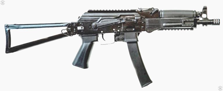 A right-side view of a Vityaz-SN with a section of Picatinny rail on both the top cover as well as the underside of the front grip. The rail on the underside of the front grip allows for illuminations aids, a vertical grip, or laser sights to be secured to the weapon. The triple-slotted muzzle break is seen at the front of the weapon. The Safety/selector switch on the right side of the receiver is in the up or Safe position. PHOTO CREDIT: RUSSIAN FEDERATION