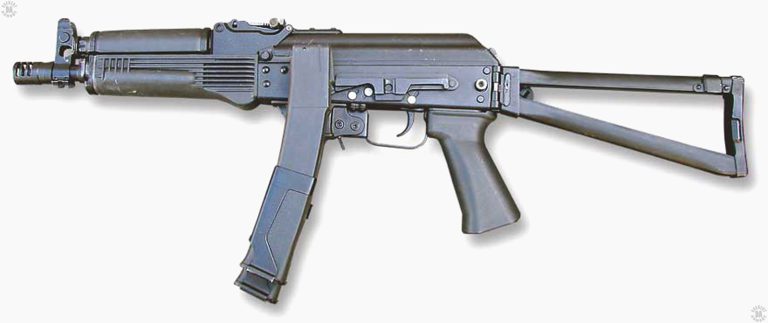 A left-side view of a variation of the Vityaz-SN. This specimen does not have a Picatinny rail section attached to it but instead has the dove-tail side rail used with many Russian optical and electro-optical sights. The specimen is loaded with a pair of 30-round magazines connected by their sheet-metal clamps. The inside (left side) magazine is higher than that loaded into the weapon so that it can be pulled down and inserted into the magazine well without the right-side magazine interfering with the weapon. PHOTO CREDIT: RUSSIAN FEDERATION