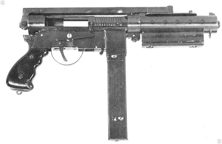The right side of the Welgun, Serial Number 2. The stock has been folded over the top of the receiver with the buttplate rotated and laying flat across the top of the barrel jacket. PHOTO CREDIT: US ARMY