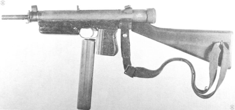 A left-side view of the Vz-24 submachine gun, the empty magazine placed under the trigger guard in front of the pistol grip. The wide identifying groove along the side of the magazine are visible in this picture, particularly up along the top half of the body. PHOTO CREDIT: US ARMY