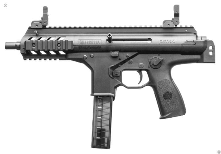 A left-side view of the Beretta PMX with the stock folded. At the center of the round receiver is the bolt with the handle set up for left-side use. The top MIL-STD 1913 Picatinny rail has been fitted with front and rear LPA folding sights. There are additional sections of MIL-STD 1913 Picatinny rail at both sides and the bottom of the front of the receiver. Visible at the muzzle is a three-lug quick attachment fitting for a suppressor. The weapon is loaded with an (empty) 30-round translucent plastic magazine. The lack of ammunition being visible through the sides of the magazine. In the front of the trigger guard is the rectangular magazine catch that is duplicated on the right side of the weapon. 
     Above the magazine catch, just below the round portion of the receiver, is the bolt catch. With the bolt to the rear on an empty magazine, the bolt latch will rise up and lock the bolt to the rear. Pressing down on the latch with a loaded magazine, or no magazine, in place, will release the bolt to move forward. Above and behind the trigger is the safety/selector switch. The switch is set on “Safe” in this picture. The numeral 1 is for semiautomatic fire. Rotating the switch through 120 degrees set the weapon on R (Raffica) for fully automatic fire. PHOTO CREDIT: BERETTA DEFENSE TECHNOLOGY