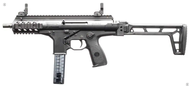 The left-side of a Beretta PMX submachine gun with the stock fully extended for use. At the front of the stock is the serrated button for unlocking the stock. This weapon has been set up for left-handed cocking with the cocking lever at the center of the bolt. All controls for operation of the PMX, except for the bolt release, the rectangular button below the cocking handle, and stock lock, are duplicated on both sides of the weapon. PHOTO CREDIT: BERETTA DEFENSE TECHNOLOGY