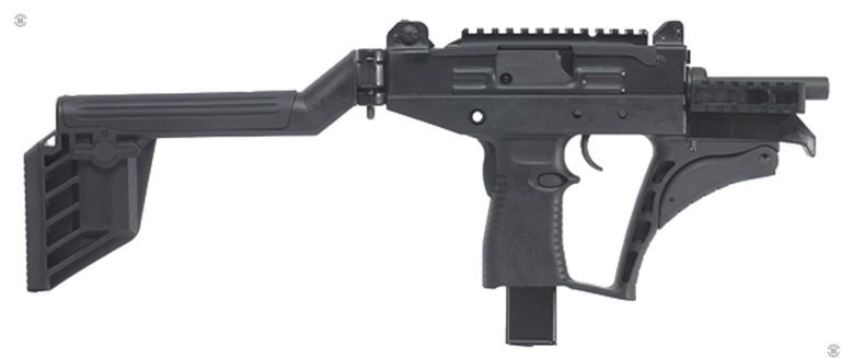 The right side of an Uzi PRO submachine gun with the stock extended. This specimen is fitted with the standard length 17 cm (6.7 in) barrel which is partially obscured by a section of MIL-STD-1913 “Picatinny” rail attached to the front of the weapon. The front assault grip is folded up against the front of the enlarged trigger guard. Below and behind the trigger is the right-side portion of the magazine catch, which can be changed for left-handed operation of the weapon. Directly behind the trigger on the back of the pistol grip is the grip safety. The stock is unfolded and locked in the extended position. The adjustable cheek rest along the top of the stock is in the lowered position. PHOTO CREDIT: IWI