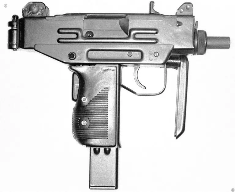 A right-side view of an early production Micro-Uzi. The weapon has a short barrel without the compensating slots cut into it, which would be visible from this side. This specimen is an IMI converted Uzi pistol from when the Micro-Uzi was being developed. One of the stand-out characteristics of this early weapon is that the buttstock folds to the left side of the weapon. Later production Micro-Uzis had the stock folding to the right side. The buttstock is oriented so that the butt itself can be used as a front grip by the shooter. Additionally, the shooter’s thumb can be wrapped around the front of the trigger guard for a more secure hold. PHOTO CREDIT: KEVIN DOCKERY