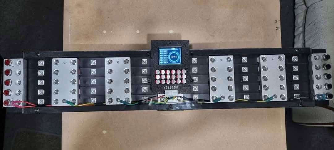 Electronic device with buttons and wires on a board.