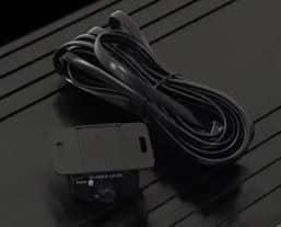 Coiled black cable with attached electronic component