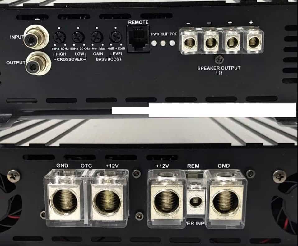 Audio amplifier ports and controls close-up view.