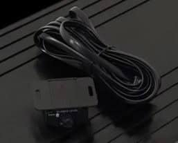 Black audio-level control knob with attached cable.