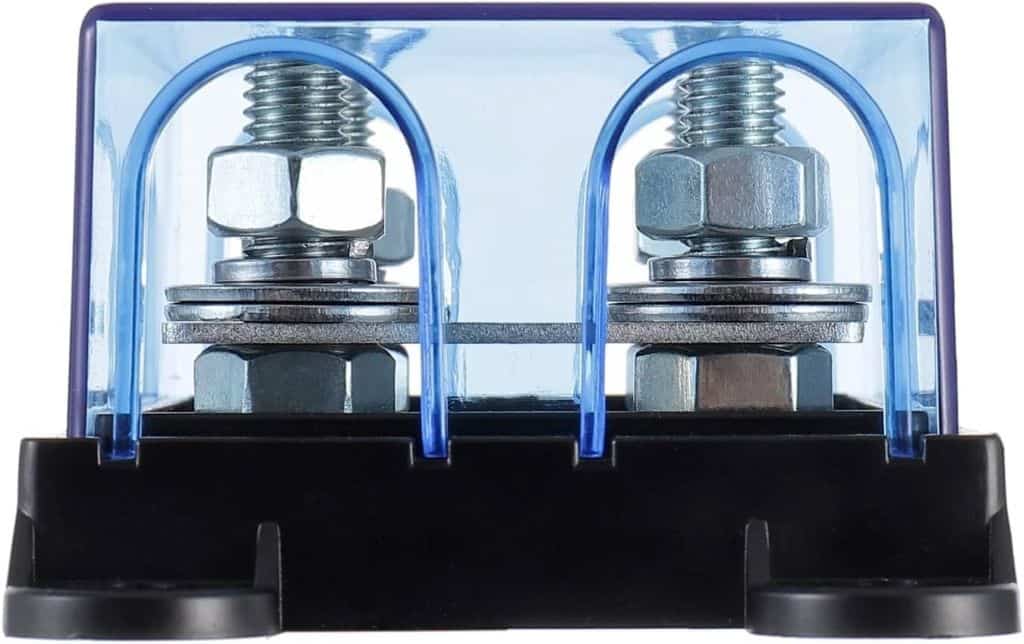 Close-up of an ANL / CNL Fuse Holder with a blue-tinted plastic cover, featuring two metal terminals and nuts on a black base. The semi-transparent design reveals the internal components and connections.