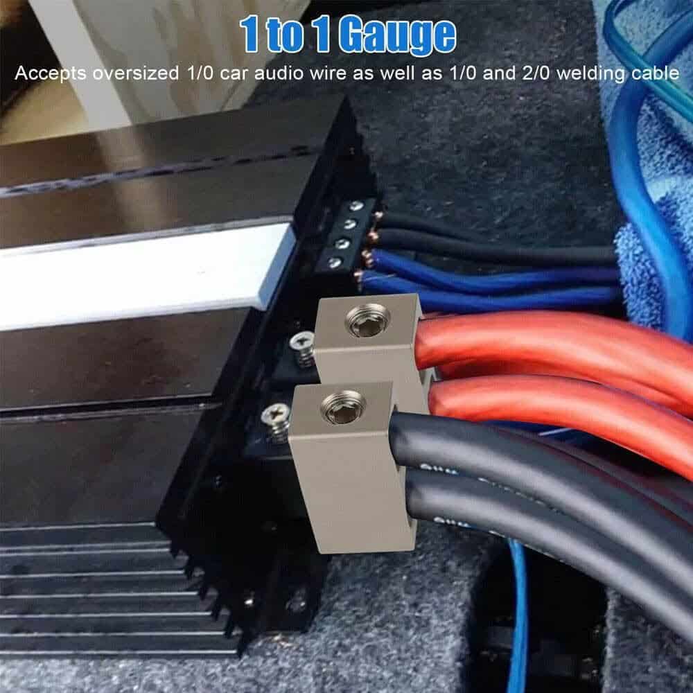 Automotive amplifier with oversized 1/0 and 2/0 gauge cables, block connectors for wires.