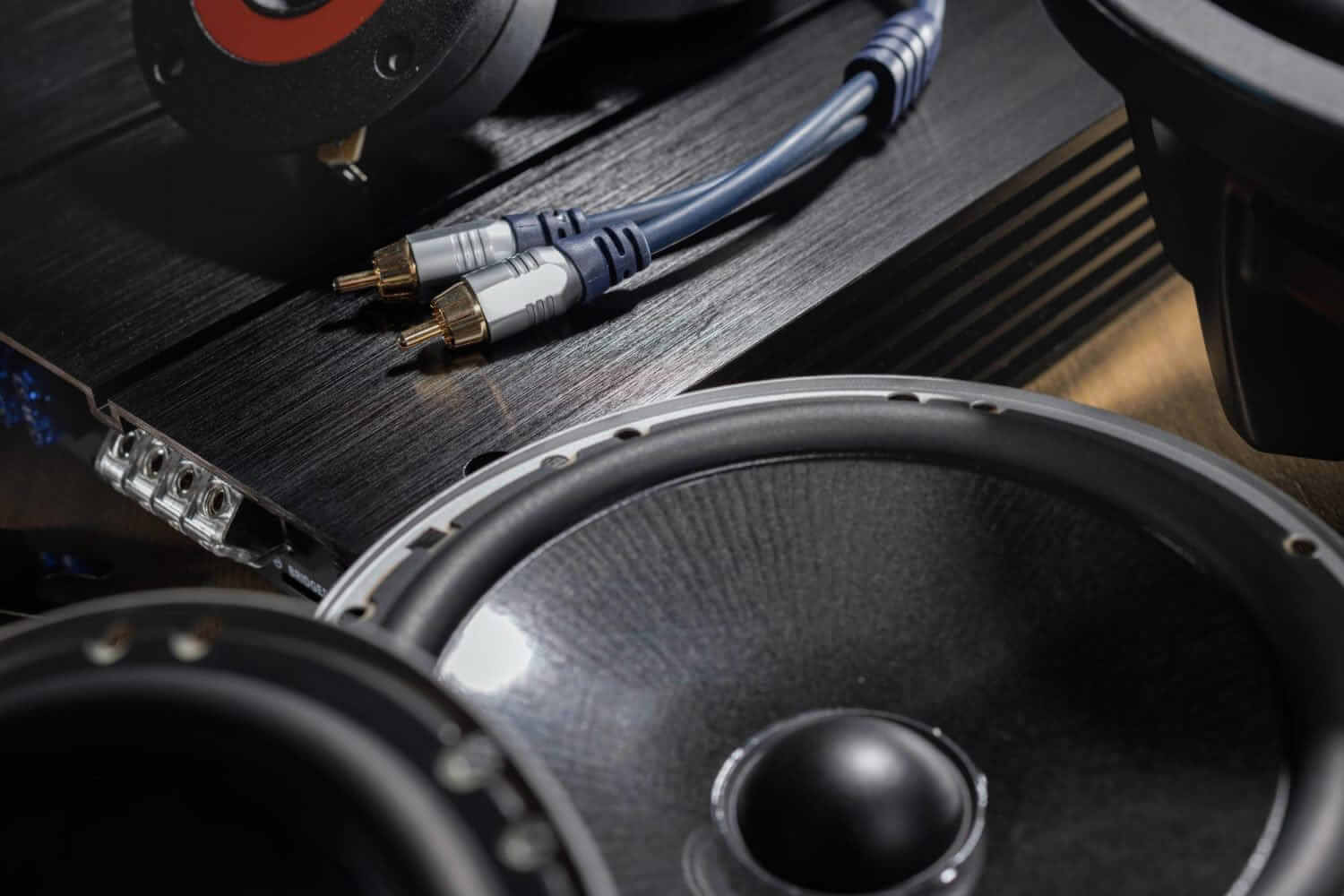 Car audio speakers and RCA cables close-up