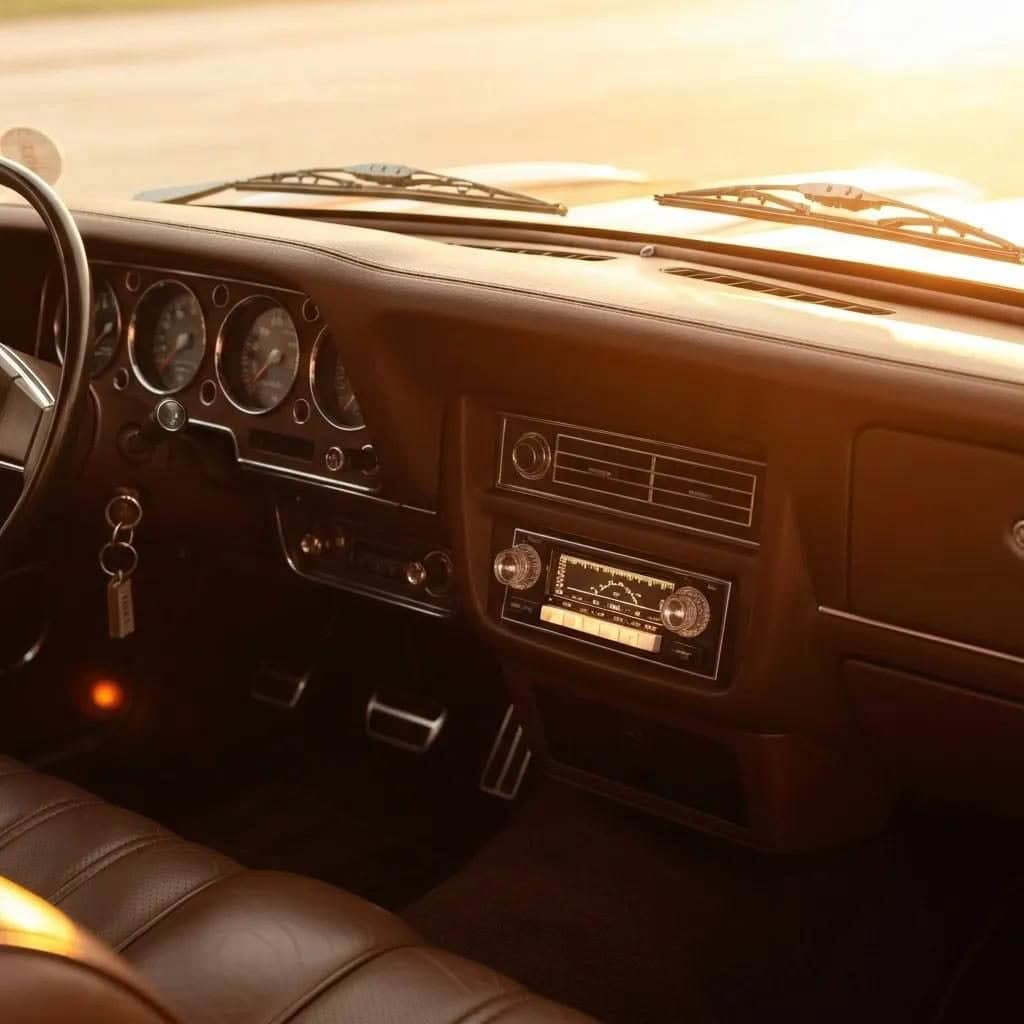 Vintage car interior with sunlight on dashboard