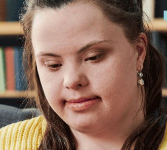 A young woman with Down syndrome in a one-to-one relationship skills counselling session