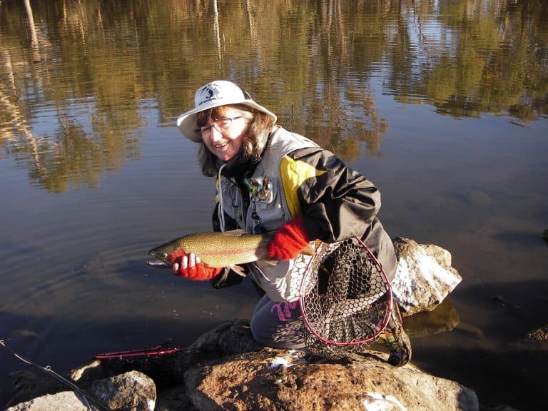 Dawn with her 1.61kg Rainbow caught on a Christmas Beetle fly