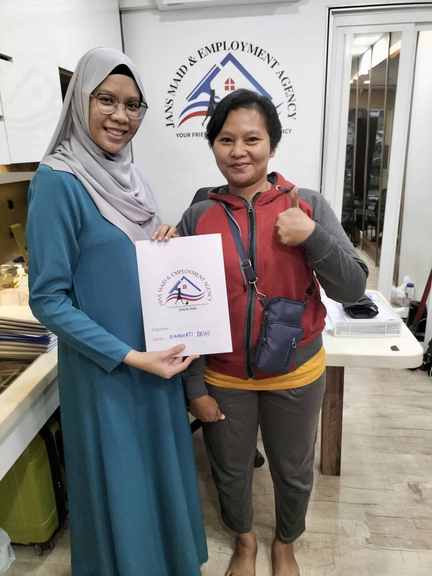 Clients signing domestic helper agreement at Jans Maid