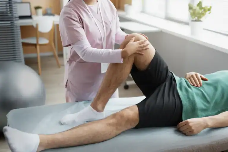 doctor-helping-patient-rehabilitation