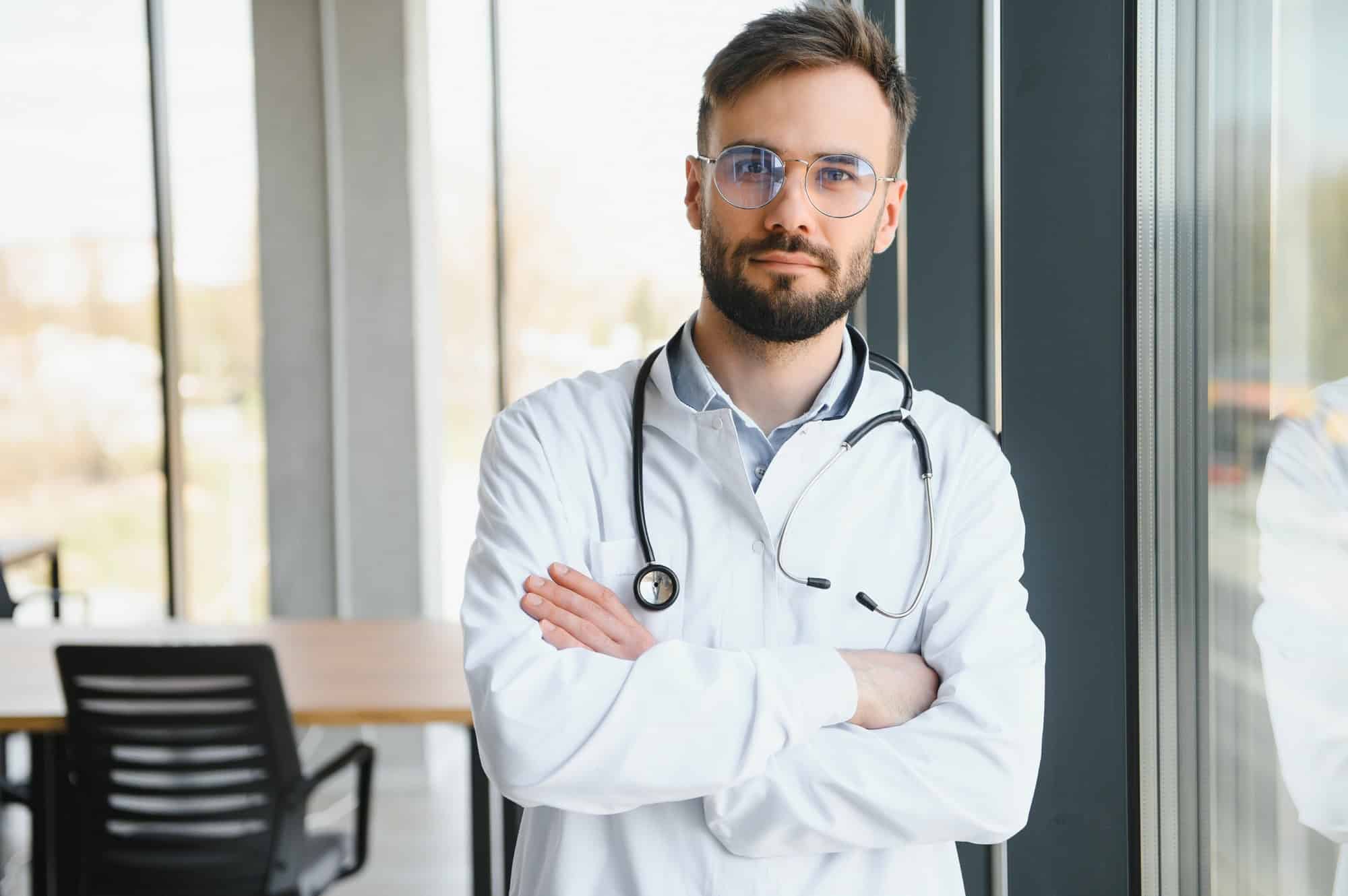 happy male medical doctor portrait in hospital