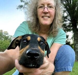 Nancy Dru trying to take a photo of her new puppy, Dru.