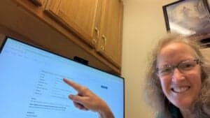 Nancy Dru at the FamilySearch Center pointing to Whatton, Nottinghamshire, UK
