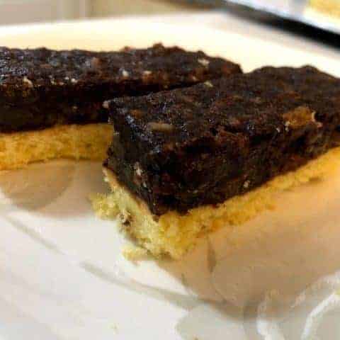 Two squares of chocolate cake, a traditional Polish dessert, on a plate.