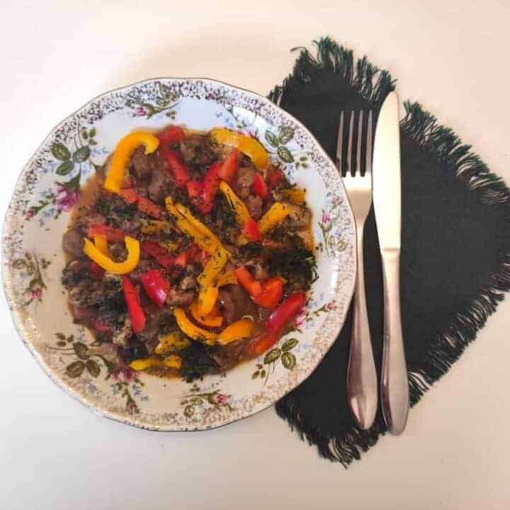 A table with a plate of goulash.