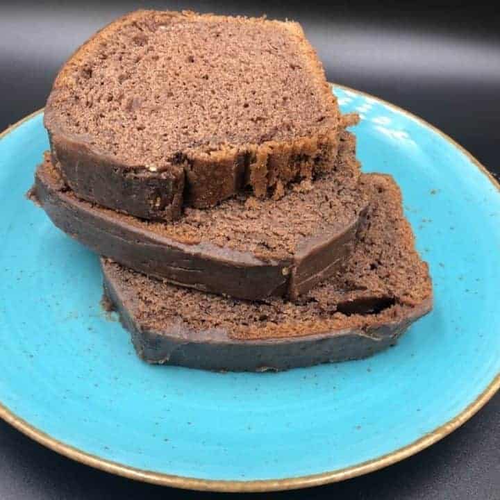 Three slices of chocolate bread on a blue plate, showcasing polish cuisine.