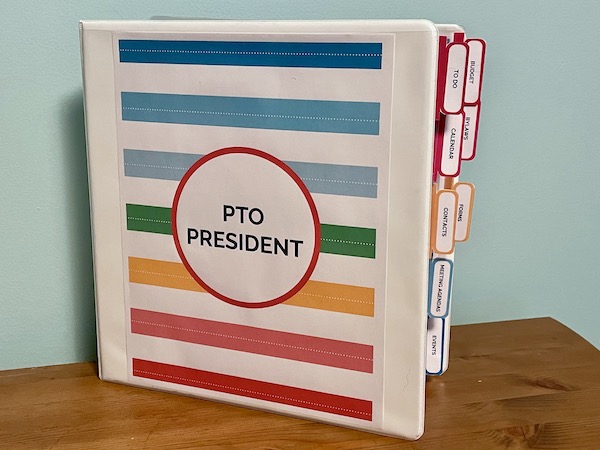 Must Have Supplies Every PTO Needs to Get Organized 1 organized PTO President's binder with colorful cover and section tabs