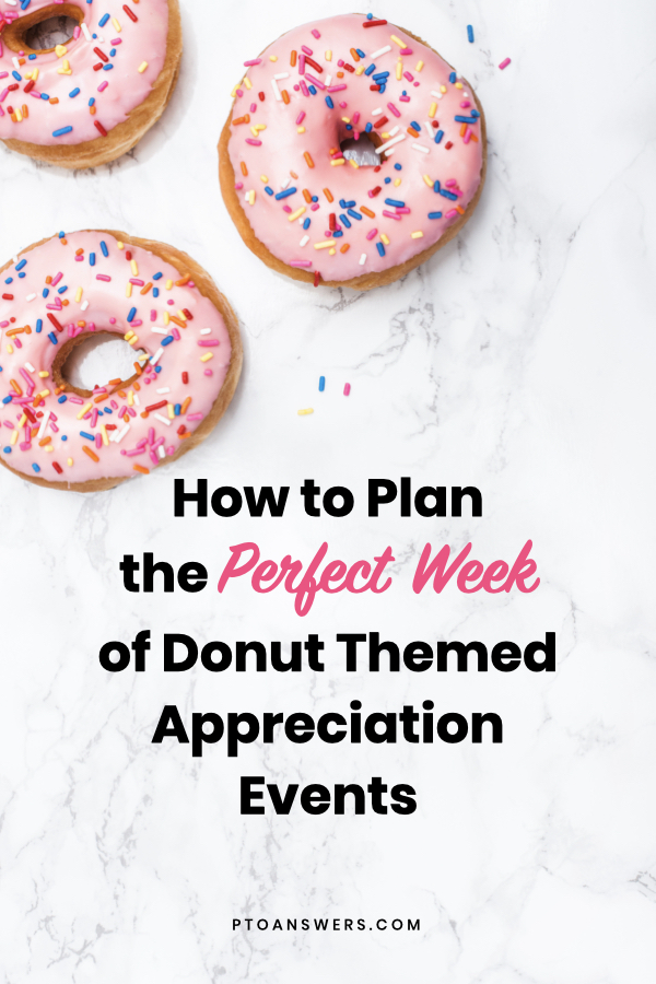 pink donuts with sprinkles on marble counter