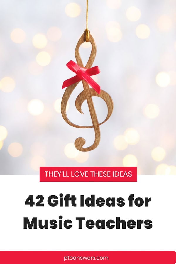 music ornament with red bow against twinkly light background