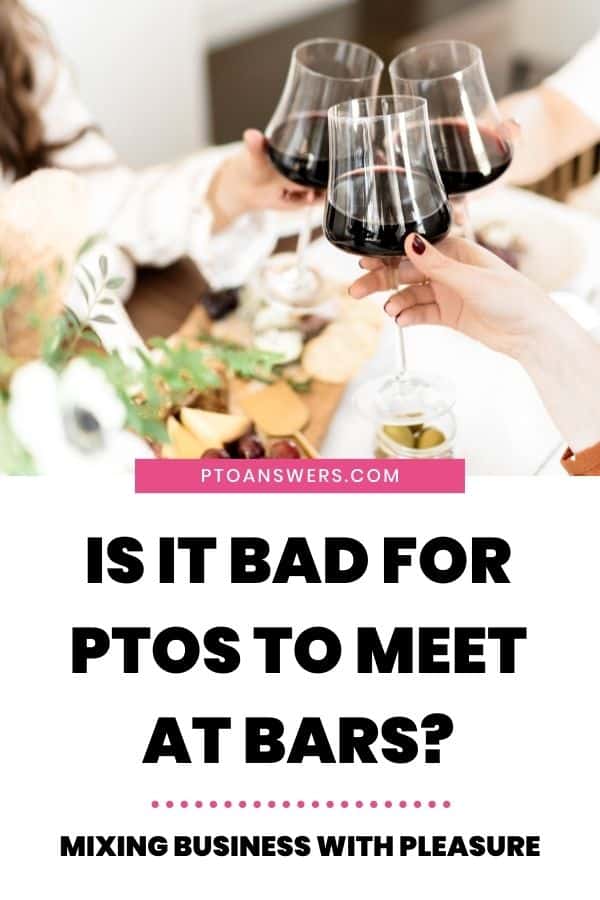 women holding glasses of red wine