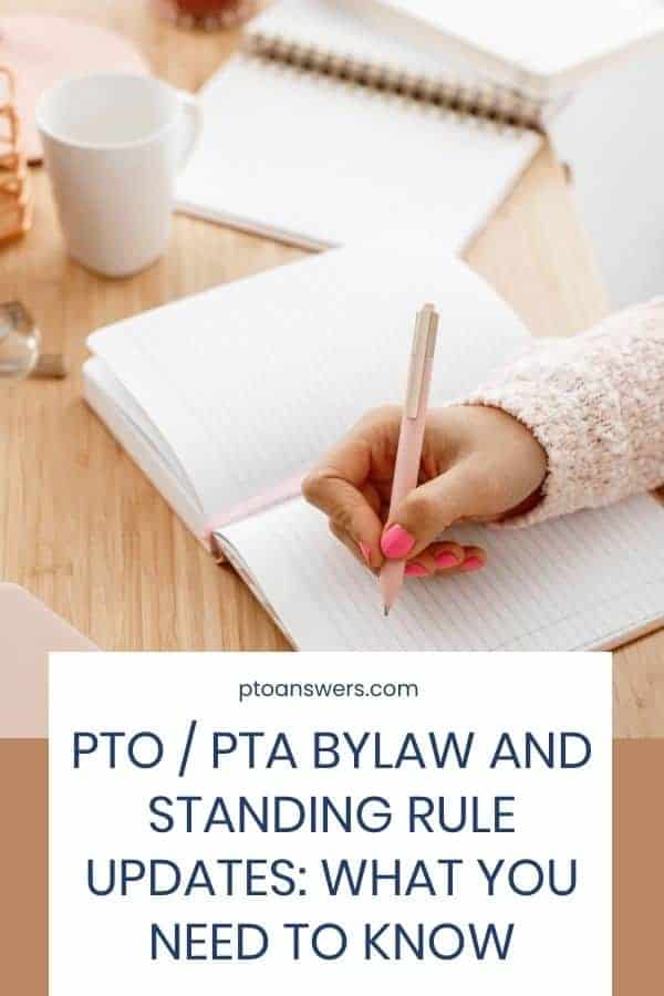 woman taking notes in a notebook at a table with assorted officer supplies