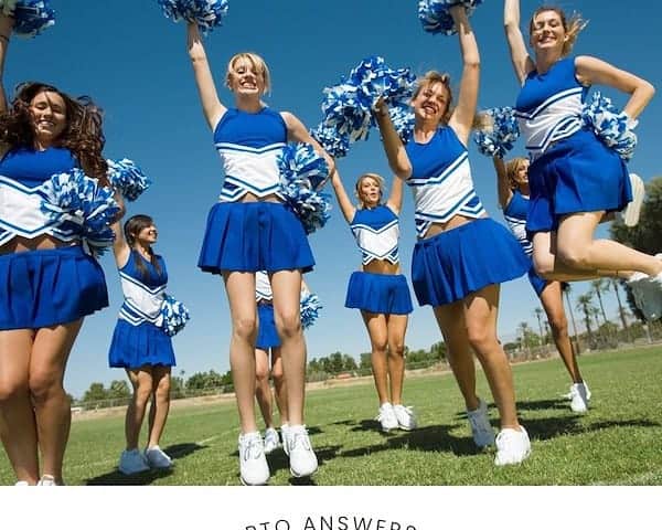 a group of cheerleaders in blue and white uniforms on a field on a sunny day with a text box below the image