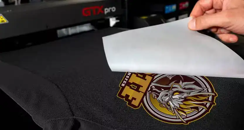 DTF printing process transferring design onto t-shirt using heat press
