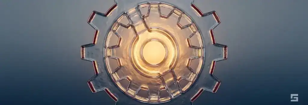 Abstract clear glass industrial gears glowing with warm amber light over a slate gray background, representing steadfast legal defense for blue-collar crimes in New Mexico. Strategic criminal defense resources by Grano Law Offices, P.C.
