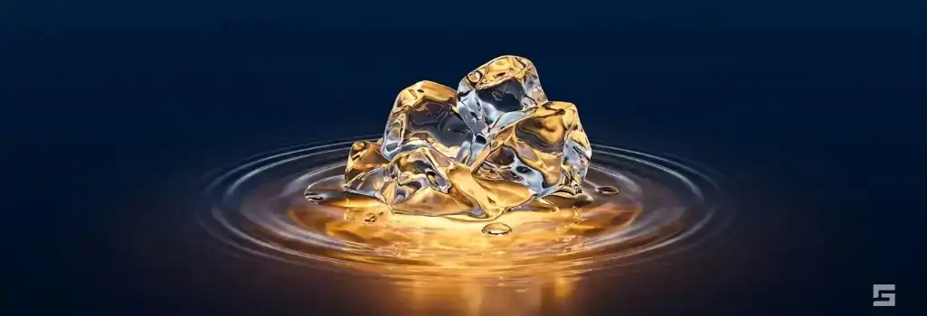 Abstract clear glass ice forms melting into water illuminated by a warm amber glow, representing safe driving and accident prevention on icy New Mexico roads. Personal injury litigation resources by Grano Law Offices, P.C.
