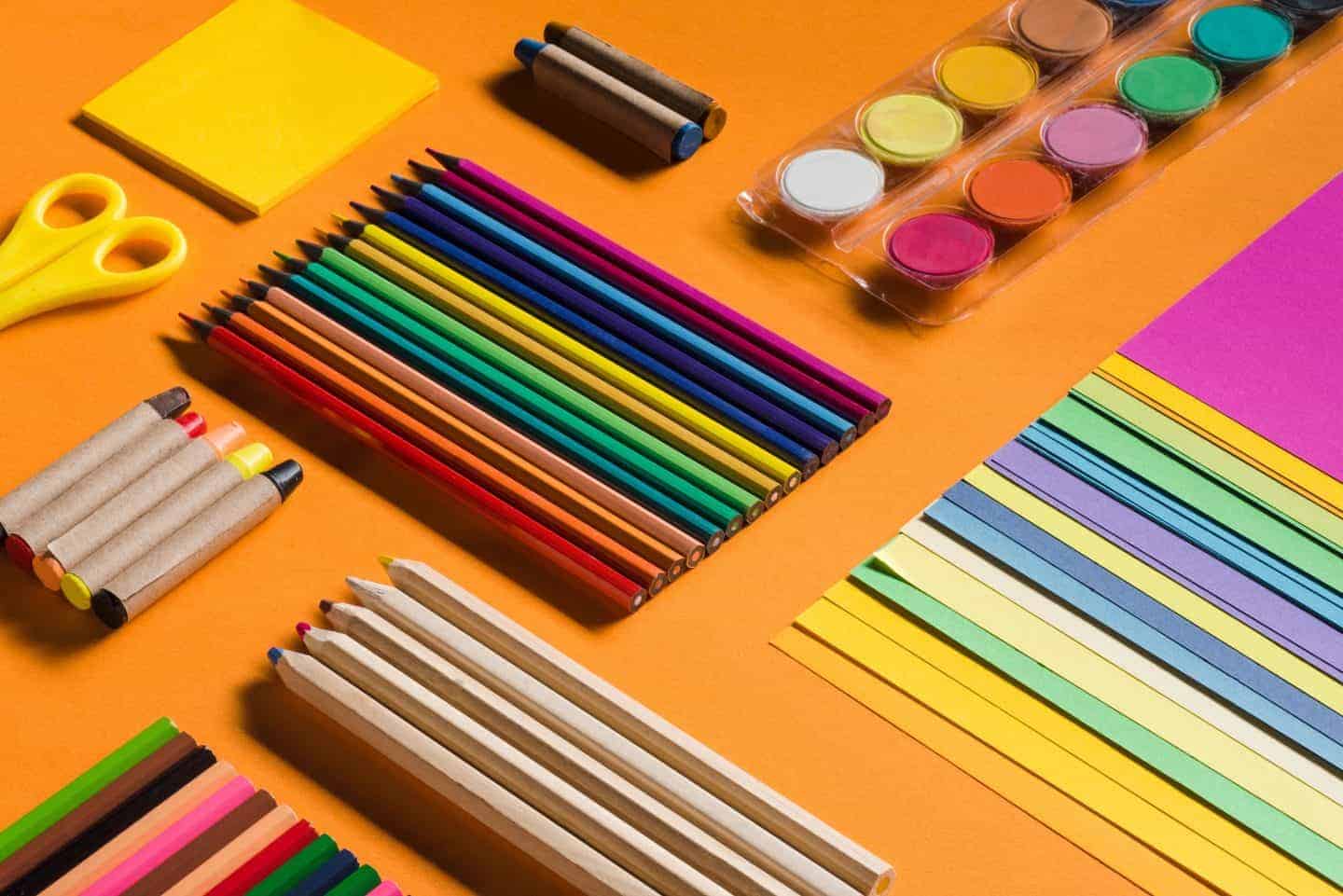 Multi-coloured stationery in orange tray