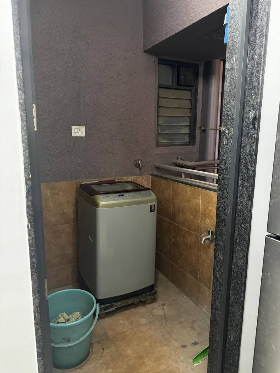 Separate utility space for washing machine and laundry.