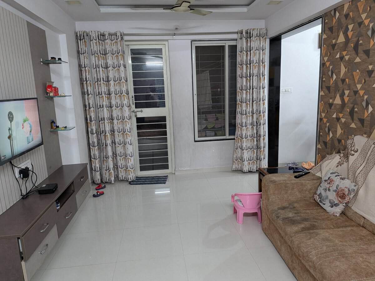 Estella Wakad rental flat hall with balcony access and bright natural light